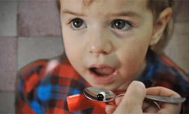 Child taking medicine